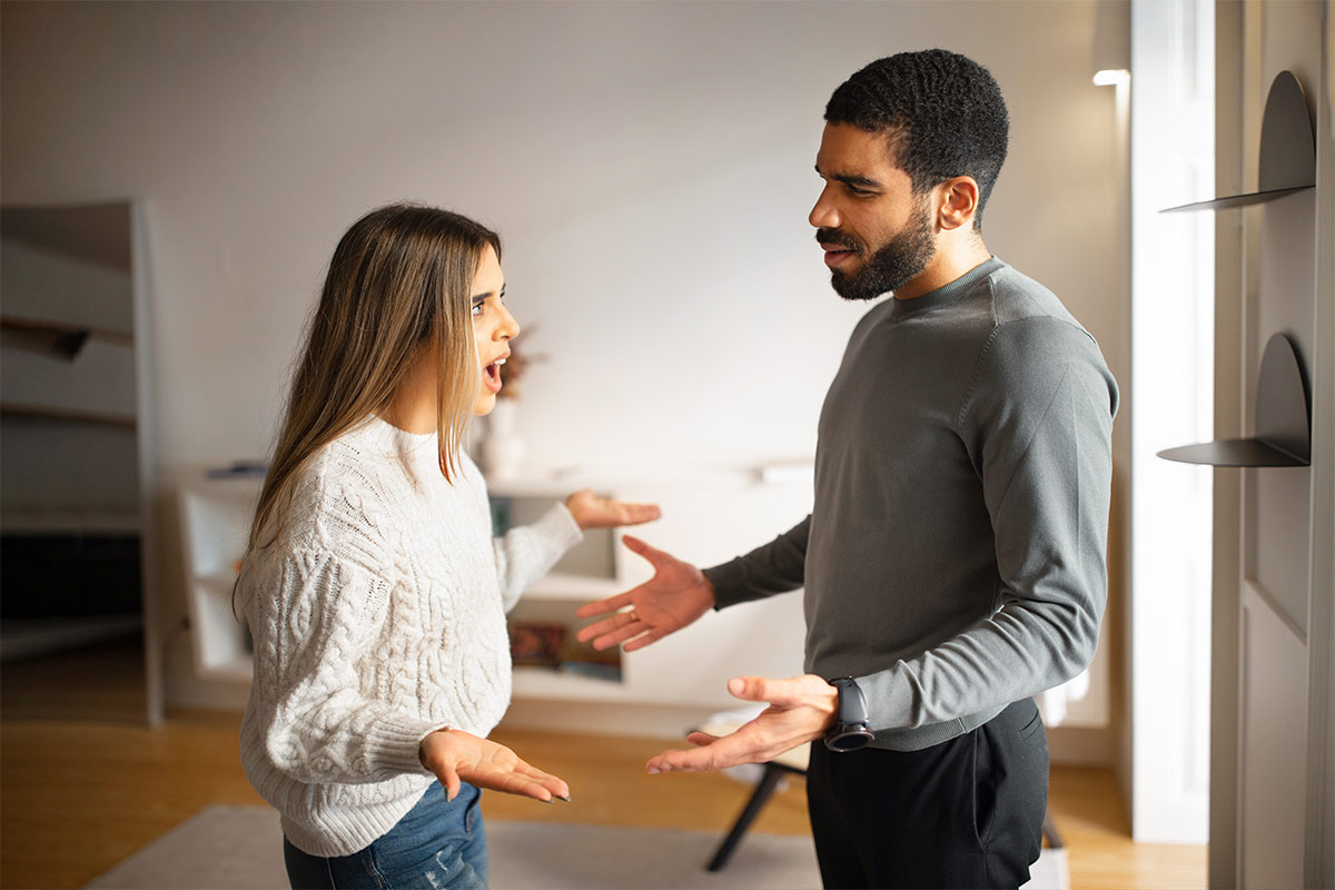 20-30 something adult multiracial couple having an argument in home during the day